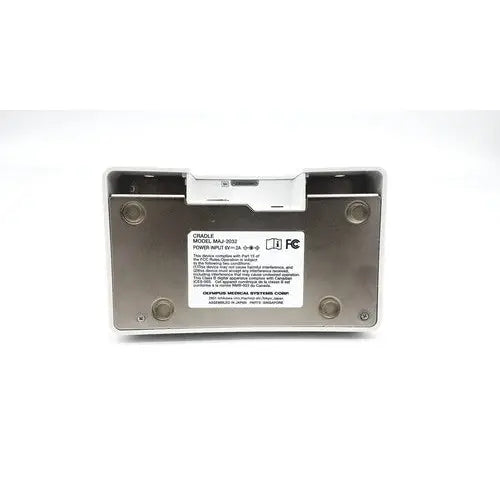 Silver metallic olympus capsule recorder re-10 medical device with white label and maj-2032 cradle backside view