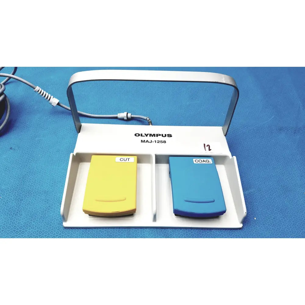 White Olympus MAJ-1258 UES-40 pedal foot switch with yellow cut and blue coag buttons for surgical use