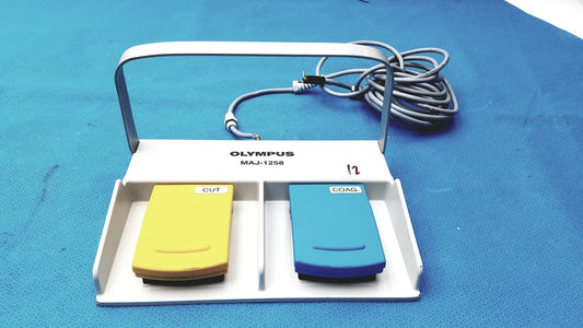 White Olympus MAJ-1258 UES-40 surgical pedal foot switch with yellow cut and blue coag buttons for precise control