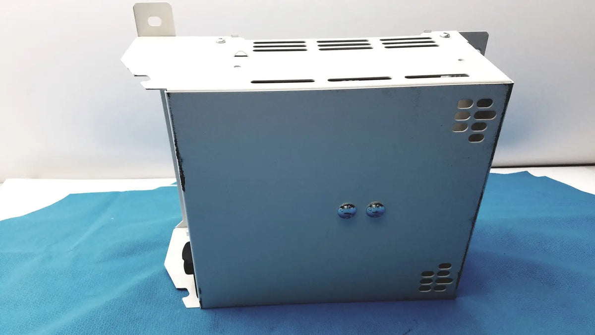 Gray metal industrial olympus separation transformer power supply unit with ventilation slots and mounting brackets