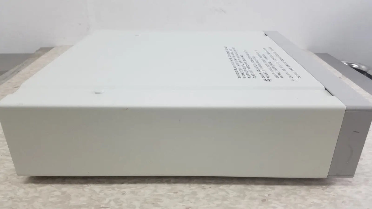 Off-white optronics microcast 3ccd electronic device with gray side panel and printed specifications on top surface