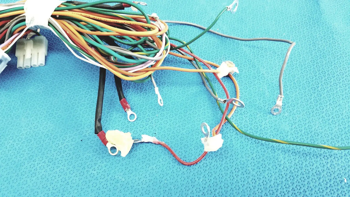 A tangle of multicolored connectors wire harness cable with plastic connectors and metal terminals for P10 103 multi-pin connectors
