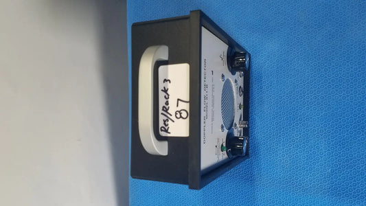 Black parks medical electronics flow detector model 811-b with white label, blue mesh panel, and two black knobs
