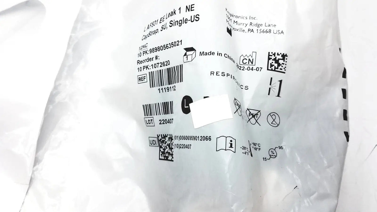 White plastic packaging with printed labels and barcodes for philips l af531 ee leak single-use capstrap reuse medical product