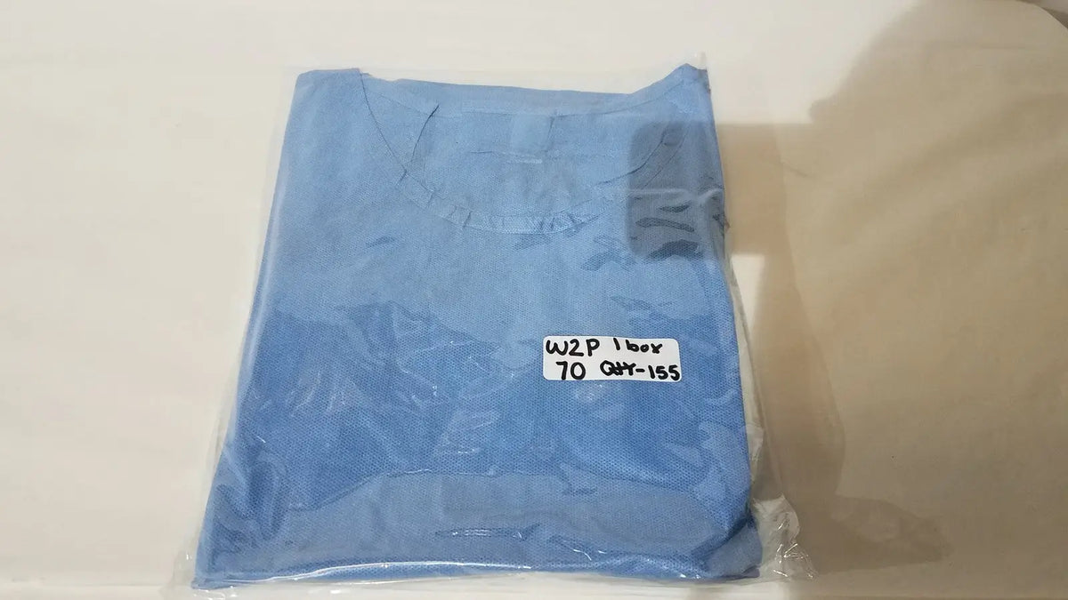A neatly folded light blue pod disposable isolation gown packaged in clear plastic with a white label for single use