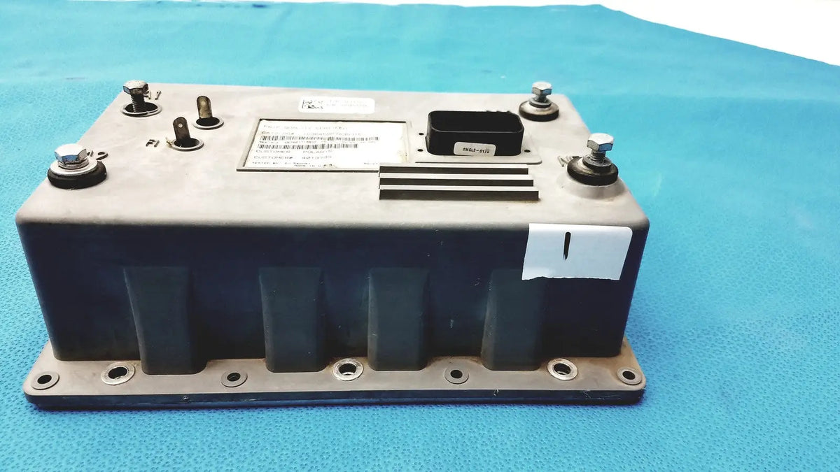 Gray and black polaris control module ecu ecm with metallic bolts label and ventilation slots for engine control unit