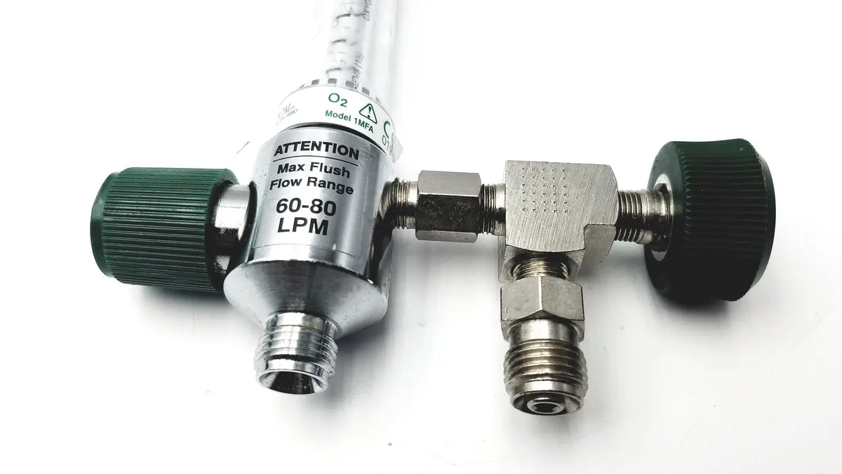 Silver precision medical oxygen flowmeter with green knobs clear tubing labeled model 1mpa max flush flow range 60-80 lpm