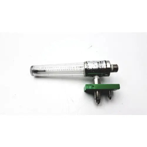 Clear glass flow meter with metallic housing and green adjustment knob for precision medical regulator gauge use