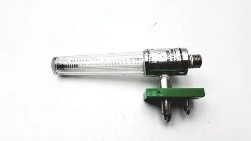 Clear glass flow meter with metallic housing and green adjustment knob for precision medical regulator gauge use