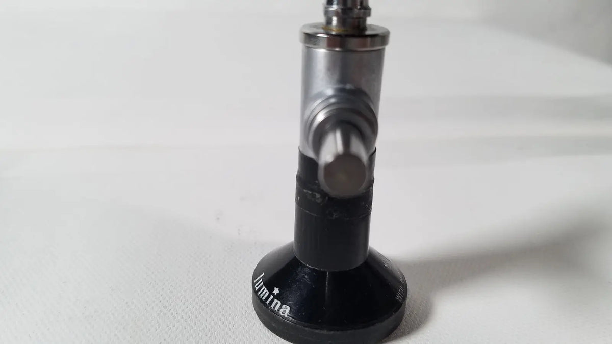 Black and silver metallic gas regulator with circular base engraved lumina for r wolf 8471.42 25 degree rigid arthroscope