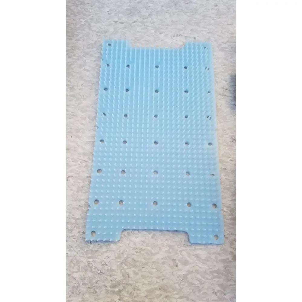 Light blue silicone radionics surgical sterlization case tray with raised dot grid and circular holes for surgical sterlization