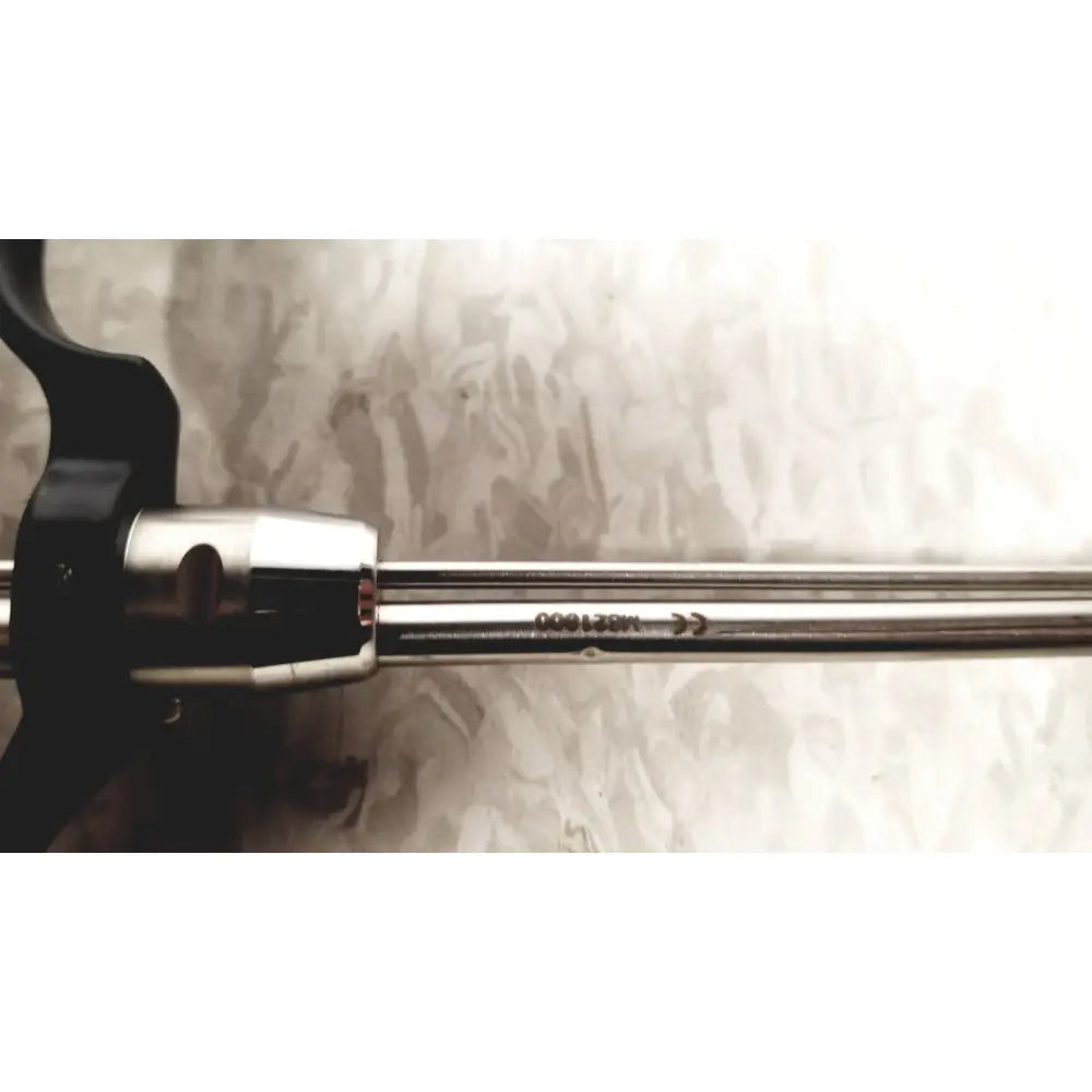 A sleek metallic richard wolf m821800 resectoscope with black ergonomic handle and polished stainless steel shaft for reuse medical use