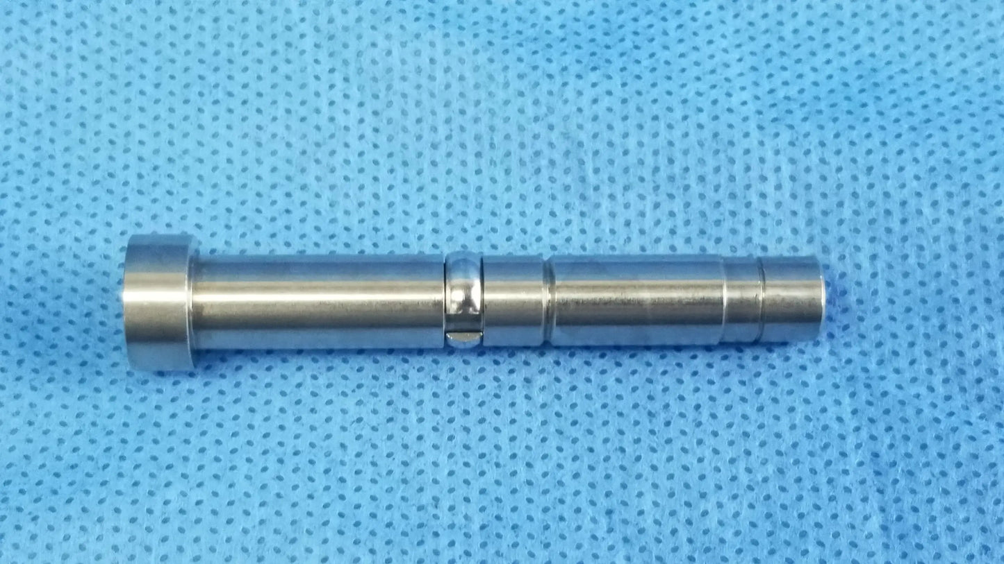 A sleek silver metal cylindrical rigid endoscope optical fiber interface adapter with polished segmented design