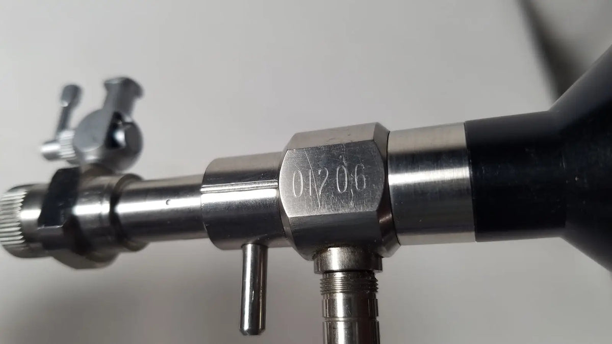 Silver metallic rigid hysteroscopes endonest gas regulator with black rubber grip and engraved serial number 01206