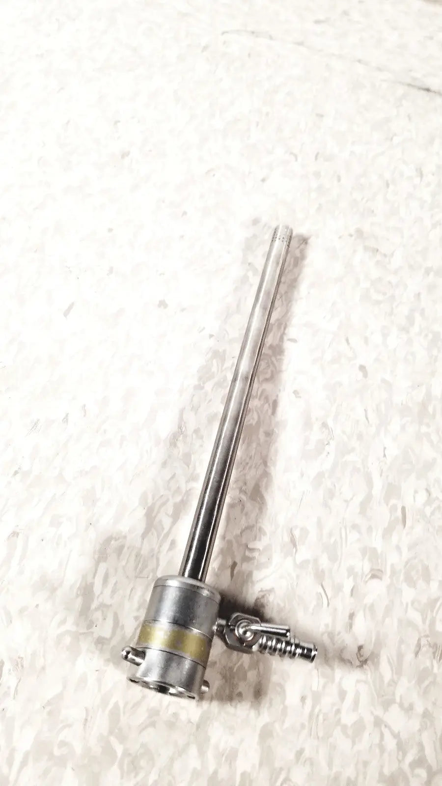 Stainless steel rotating single stopcock cannula with long slender shaft and threaded connector at base