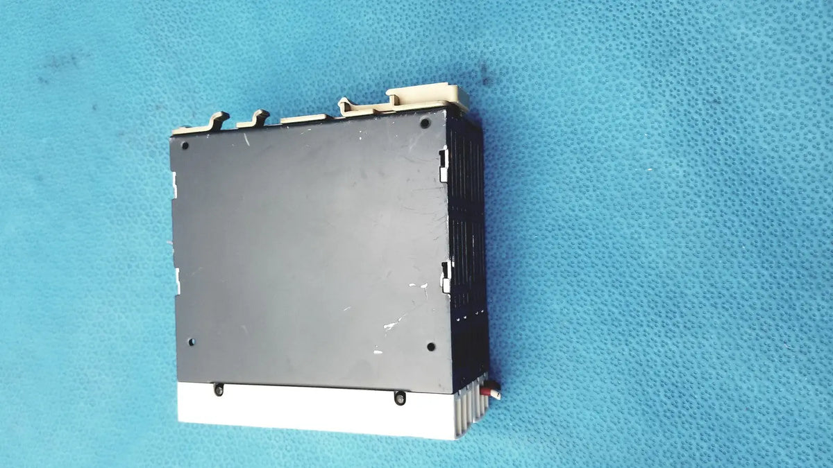 Black and white schneider electric abl7 rp1205 switch mode power supply with ribbed heat sink for din rail mounting