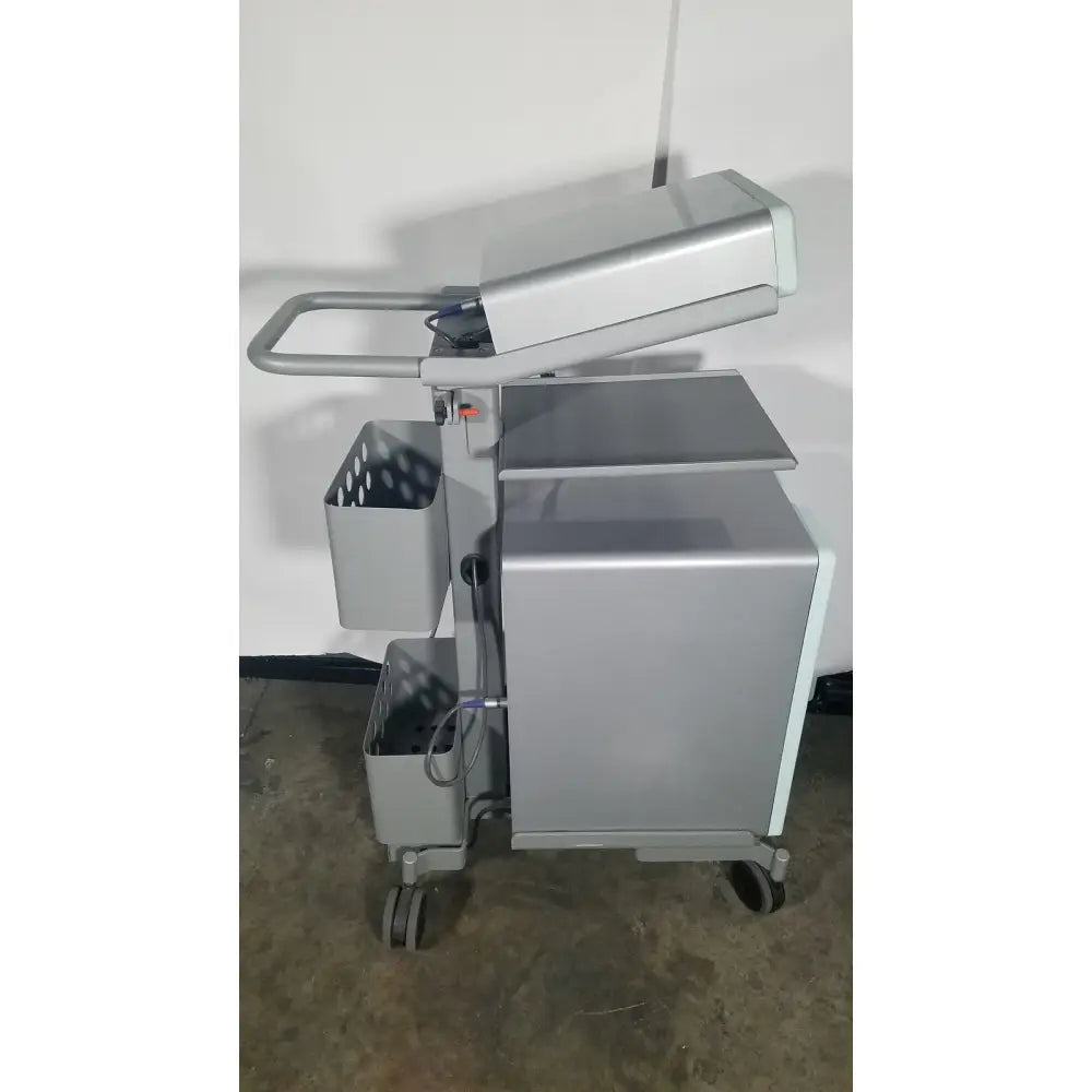 Silver metallic medical cart with multiple compartments and wheels for senoRx cm3000 control module in encor breast biopsy system
