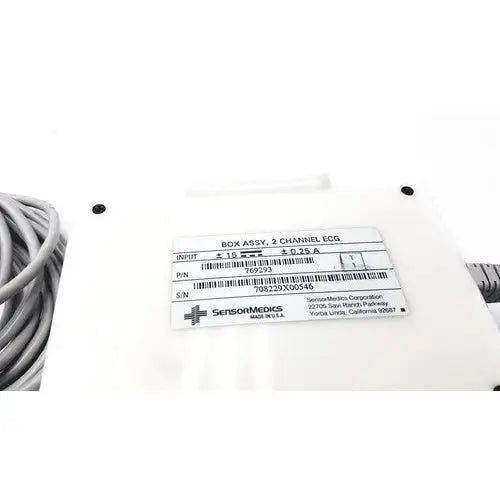 White plastic SensorMedics 3-channel ECG box with two-channel ECG label and coiled gray cable for monitoring