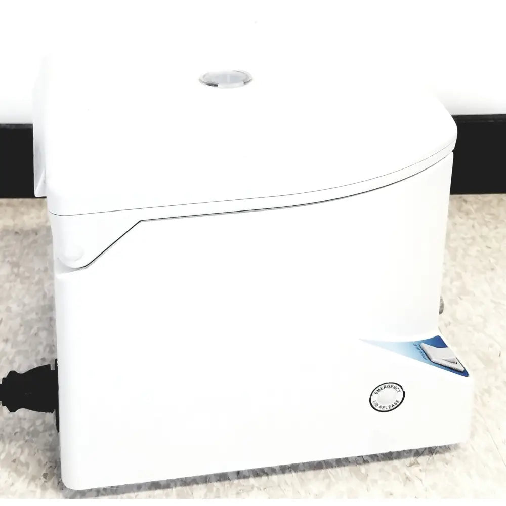White plastic toilet tank with circular flush button and emergency release label featured in separation technology micro centrifuge