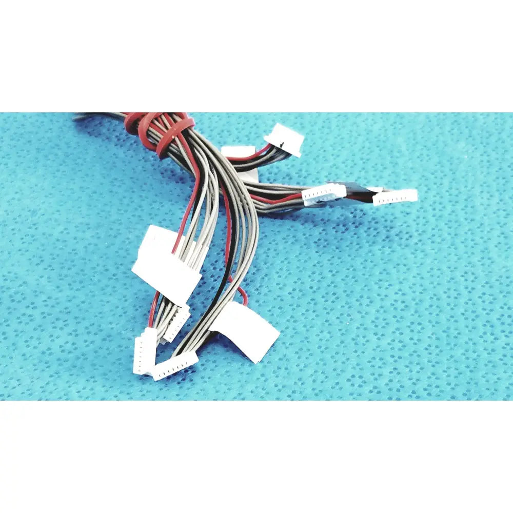 A bundle of multi-colored flat cables with white plastic connectors in shinagawa awm 1007 female connectors wire harness