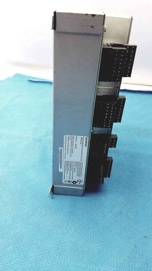 Silver metallic siemens apogee automation 549-627 1210 modular equipment controller with black terminal blocks and white label