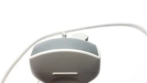 Gray plastic earbud charging case with sleek rounded design and metallic accent for siemens linear array ultrasound probe