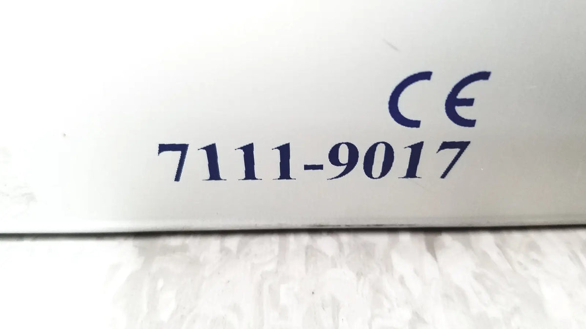 White plastic surface with blue ce marking 7111-9017 on smith & nephew 5.5 mm cannulated screw set instrument tray missing piece