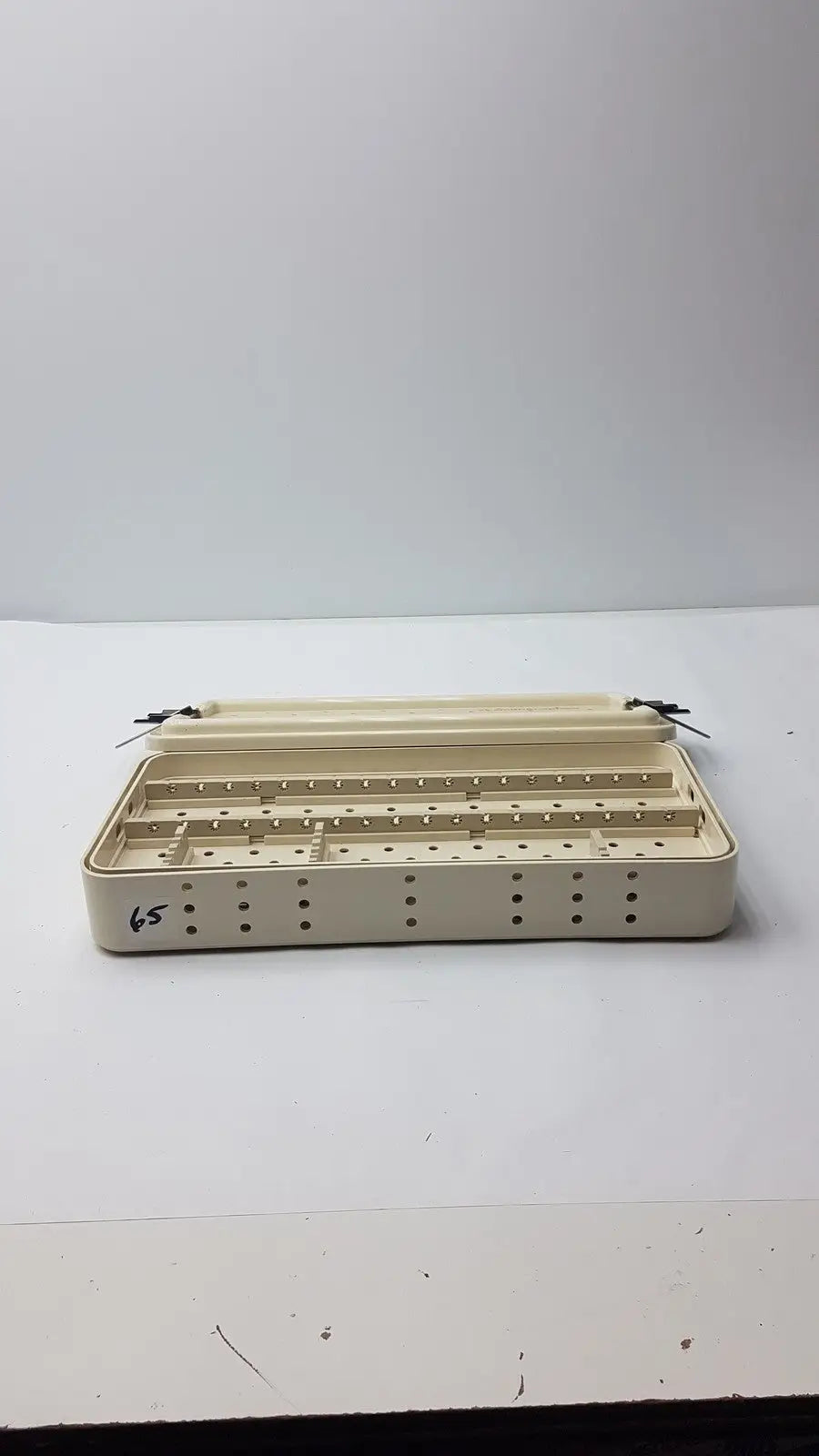 Beige plastic nephew ref 7207934 hip arthroscopy empty tray with multiple compartments and perforated sides