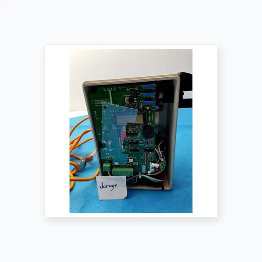Green circuit board with electronic components and small screen in beige plastic enclosure for smiths medical fluid warmer unit