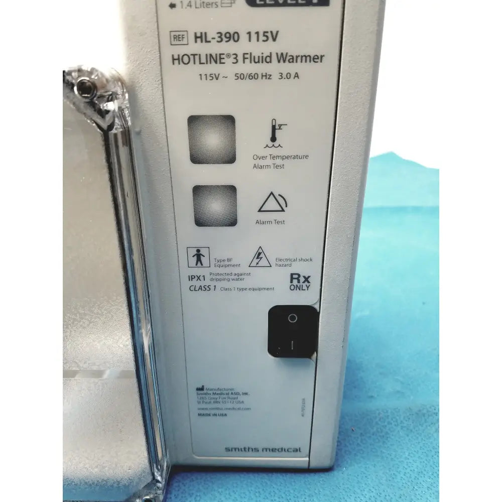 Silver metal medical fluid warmer labeled hotline 3 by smiths medical for efficient patient fluid warming