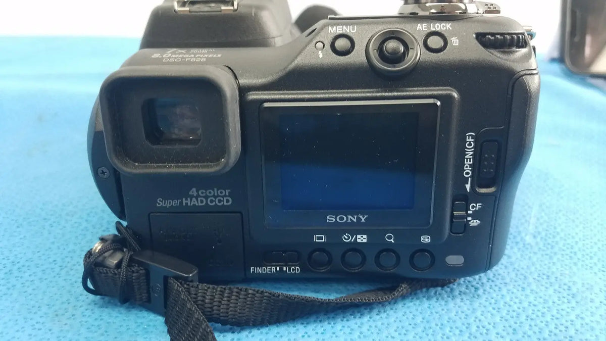 Black sony cyber-shot dsc-f828 digital still camera with 4-color super had ccd sensor and lcd screen shown from back side