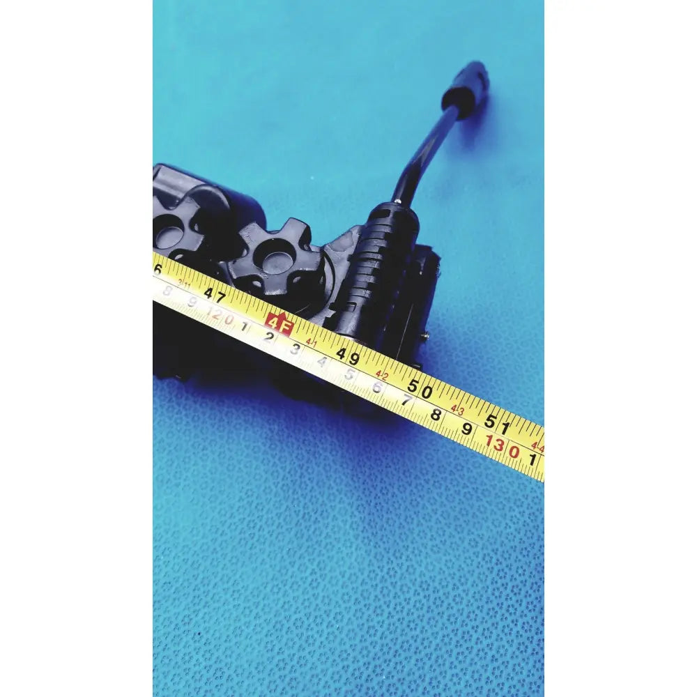 Black plastic hydraulic control valve with yellow measuring tape on the back side of sony vct-r640 lightweight extendable video tripod