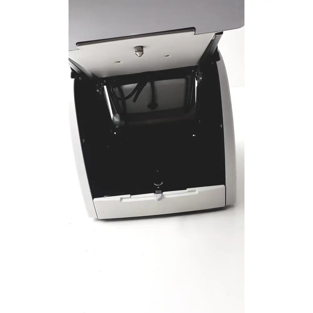 Silver and black cash counting machine with hinged lid and internal rollers shown with sperian titmus i300 vision screening system