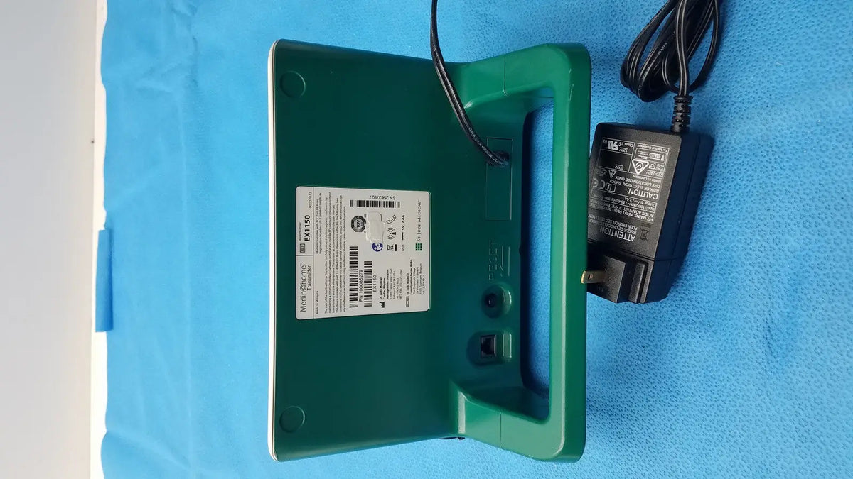 Green plastic st jude ex1150 wifi transmitter unit with handle power cord and white label on its back side