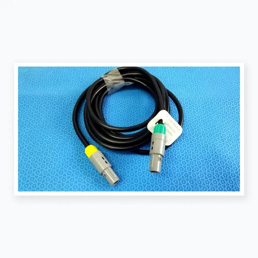 Black coiled medical equipment catheter connection cable with gray connectors and yellow green accents for reuse medical equipment
