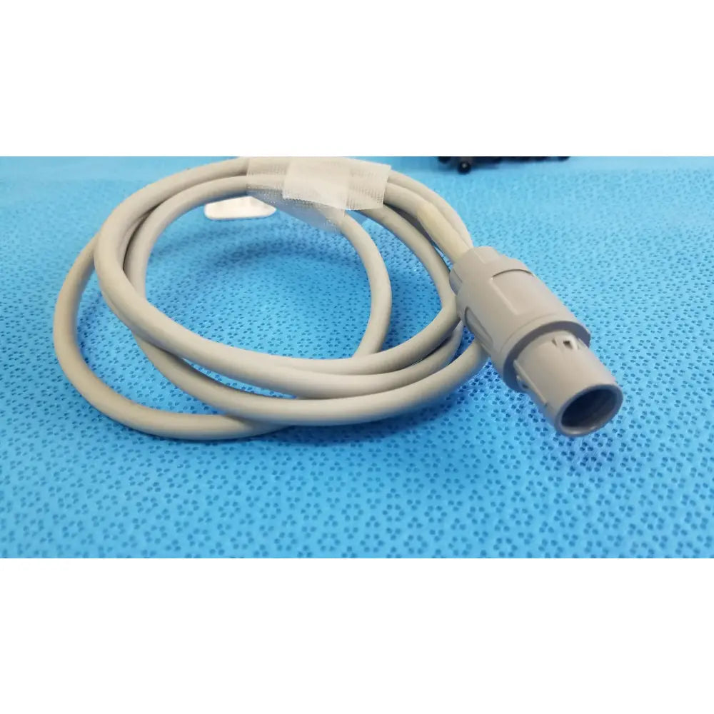 Beige medical-grade jude medical inquiry diagnostic connecting cable with molded plastic connector and protective tape
