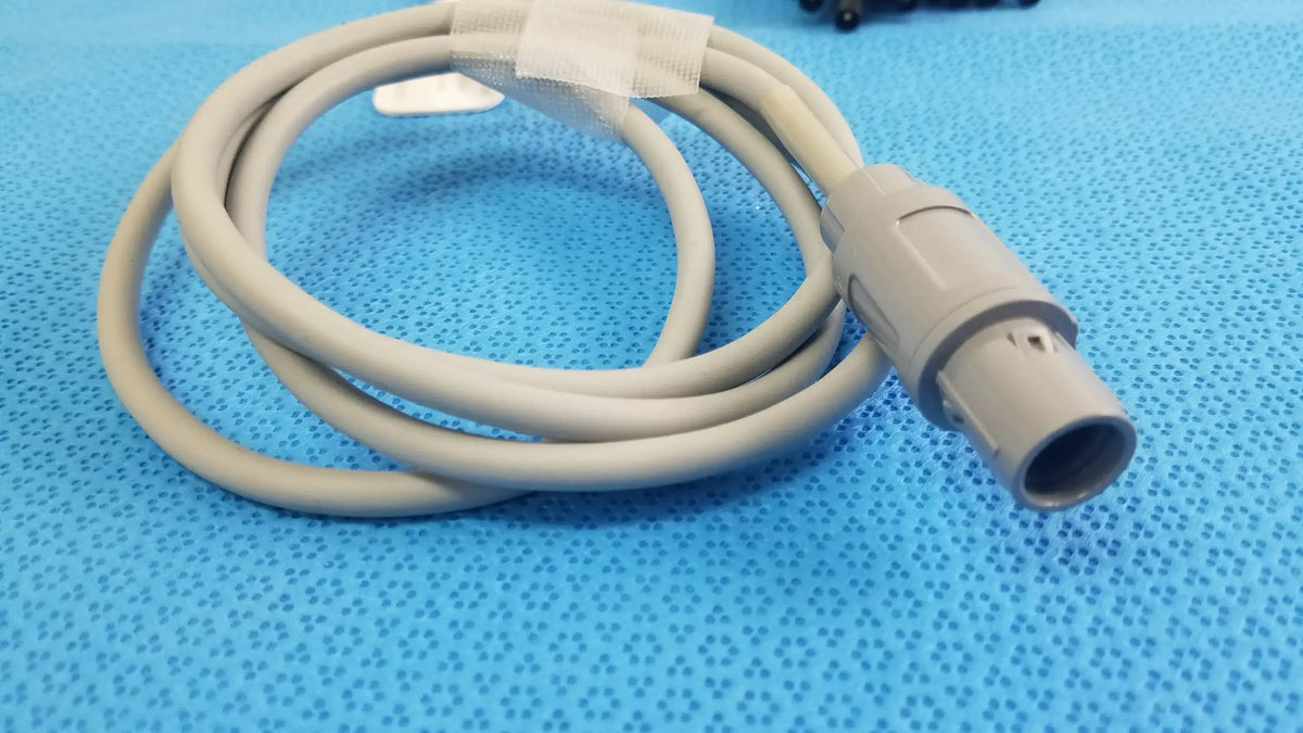 Beige medical-grade jude medical inquiry diagnostic connecting cable with molded plastic connector and protective tape