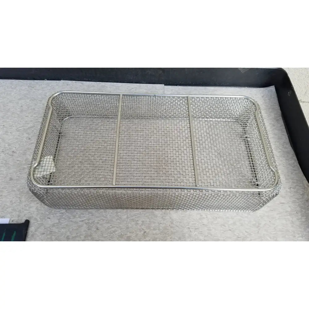 Rectangular stainless steel basket for sterilization case with three internal dividers and durable steel construction