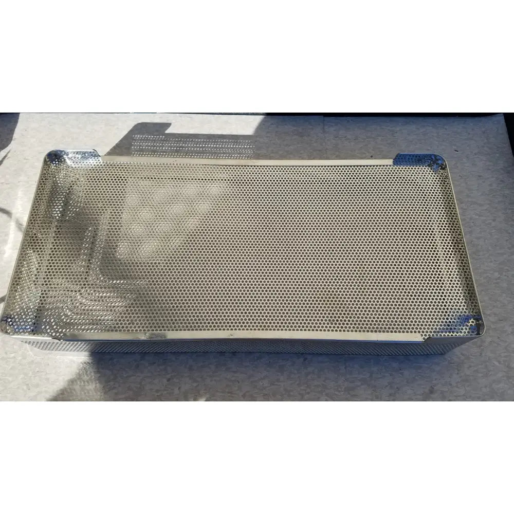Rectangular stainless steel instrument sterilization basket tray with reinforced corners and uniform perforated surface