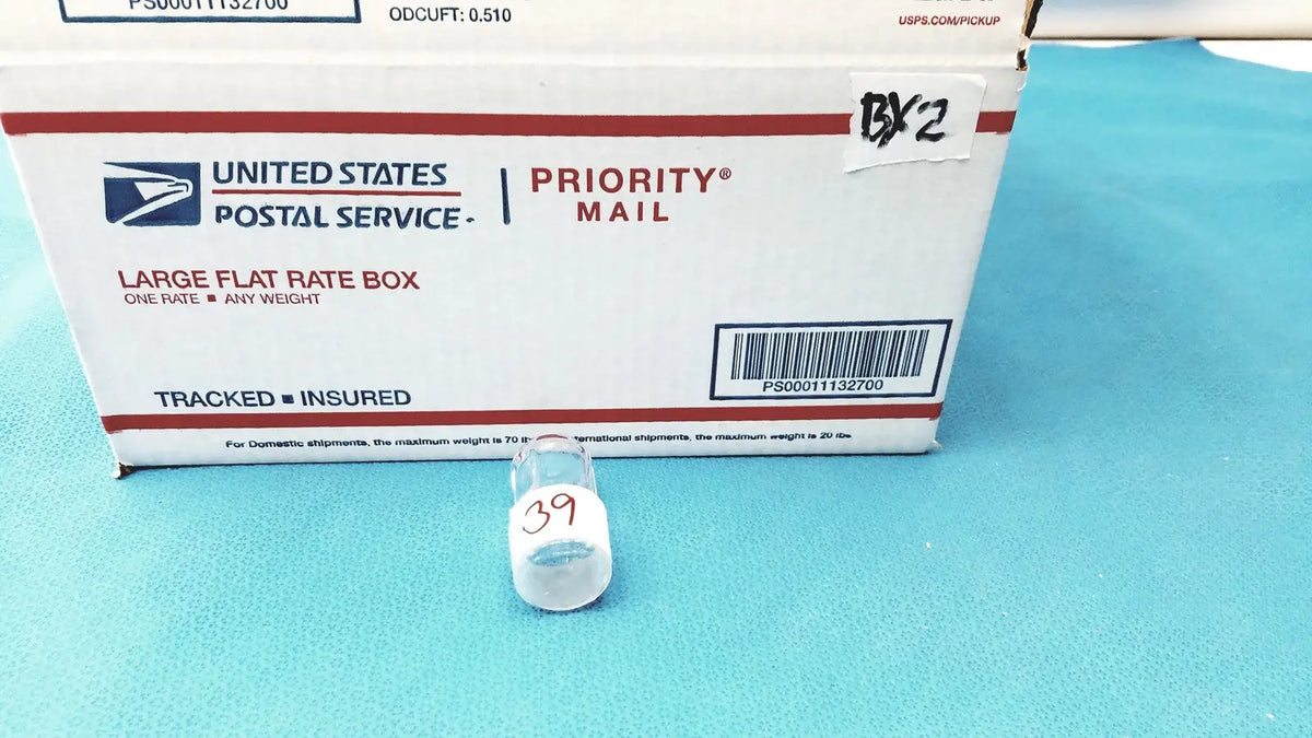 Clear plastic vial with white cap and red handwritten 39 number for standard taper hollow ground glass stopper plug