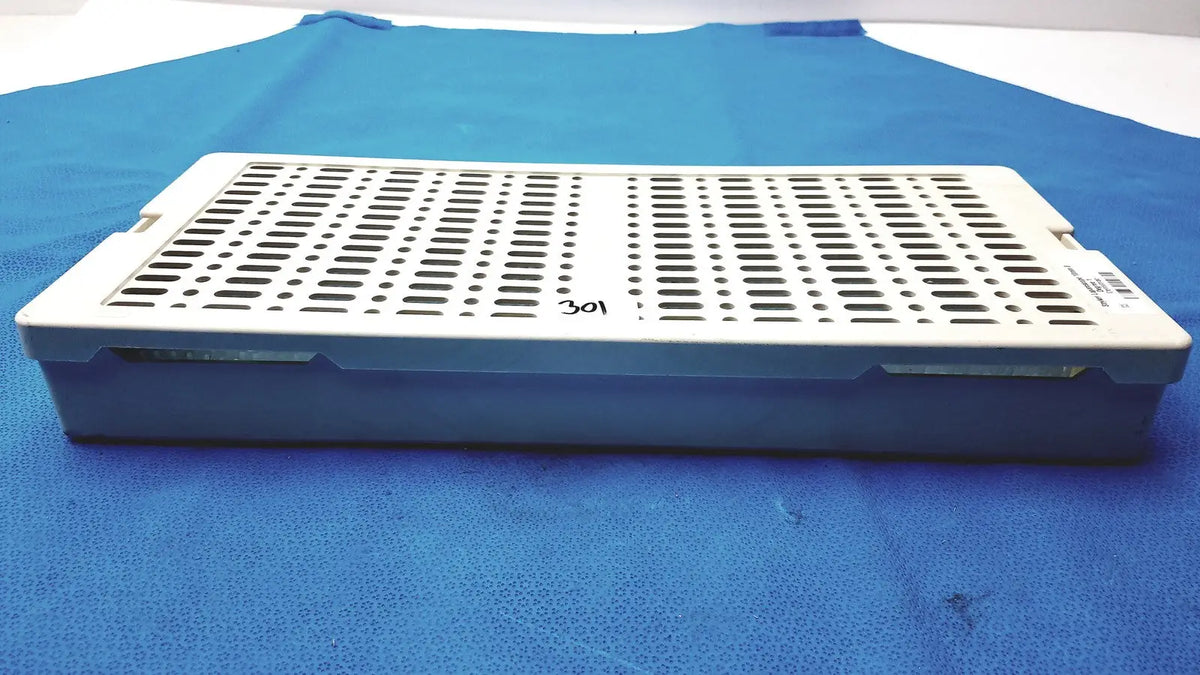 Sterrad NX standard white plastic surgical instrument tray with perforated top and blue base for standard sterilization container