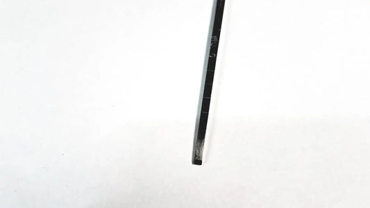 Black metal ruler with engraved markings and a worn edge for storz cottle nasal 4mm blade surgical knife use