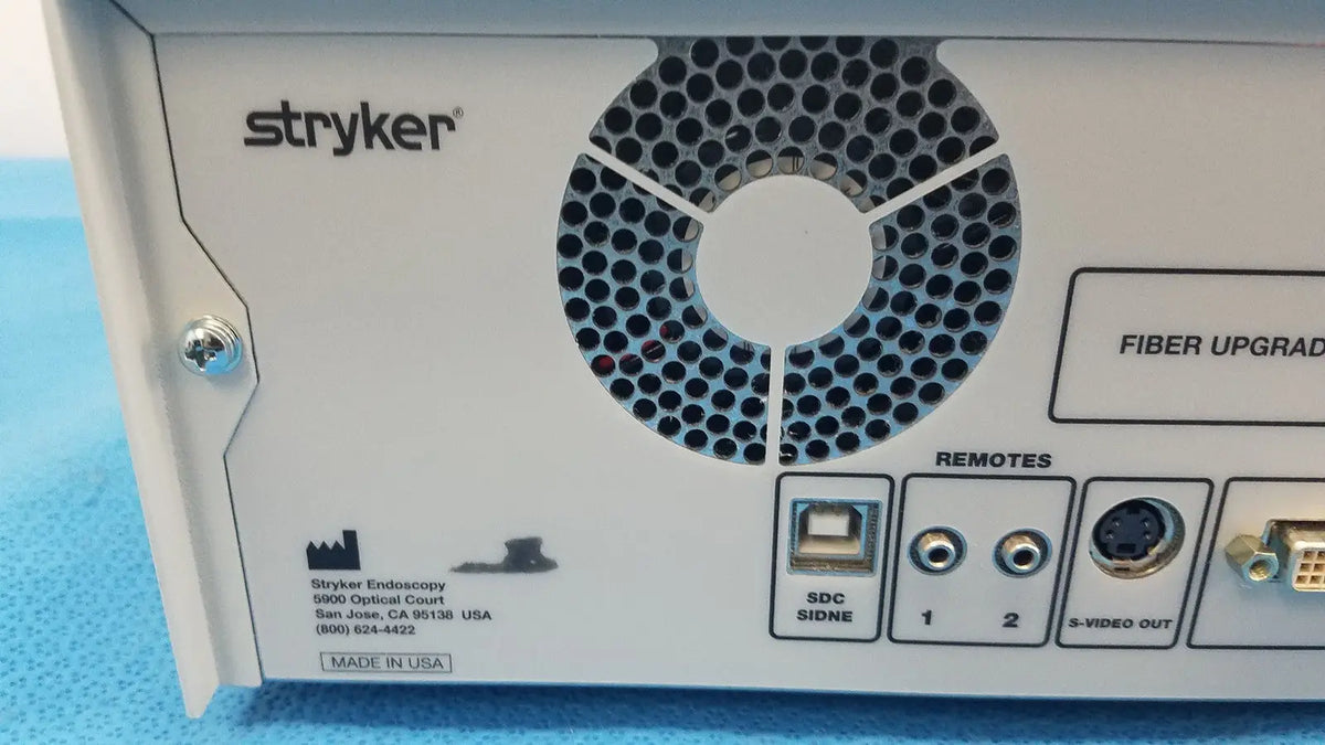 Back view of white stryker 1588 aim hd camera system with circular vent usb ports and audio video connectors for reuse medical use
