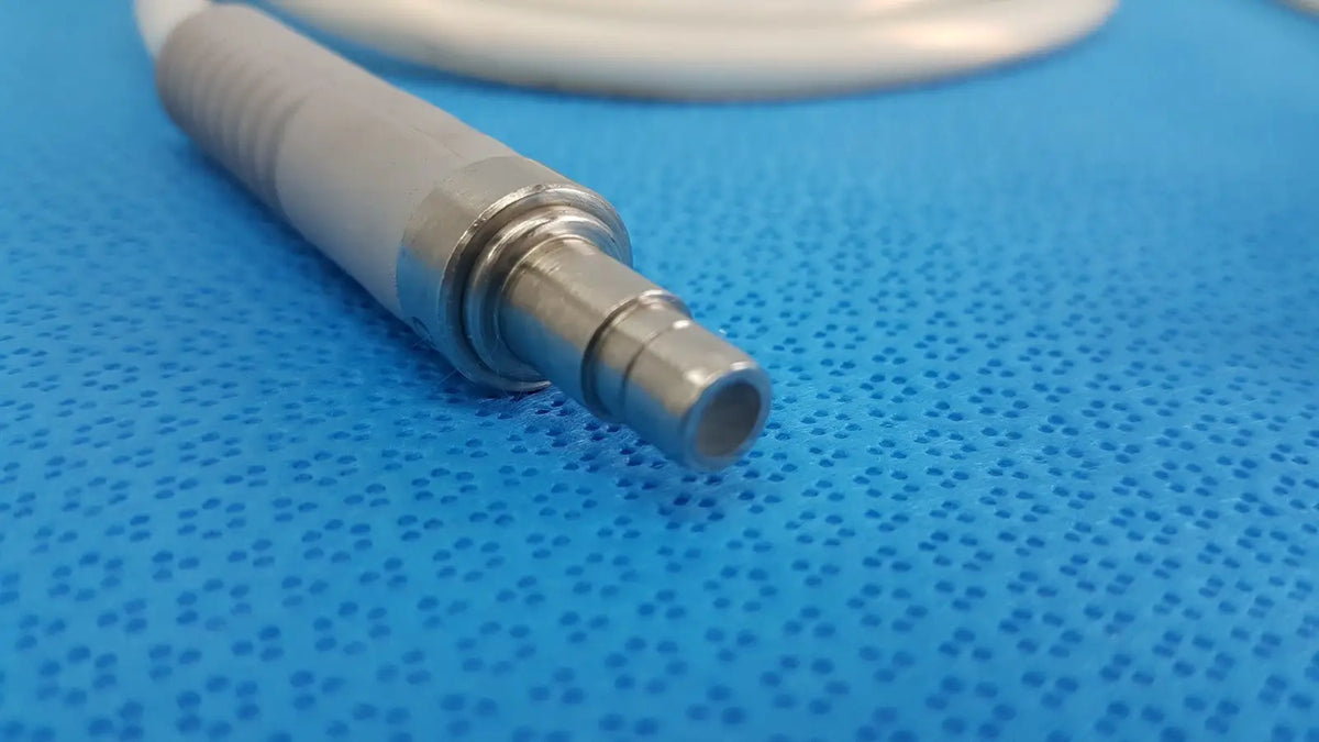 Gray and metallic stryker 195q fiber optic dental handpiece with textured grip and threaded connection for precision use