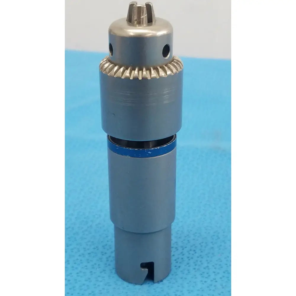 Stryker 4100-131-000 gray metallic 1/4 inch drill attachment with gear-like collar and blue ring for reuse medical use