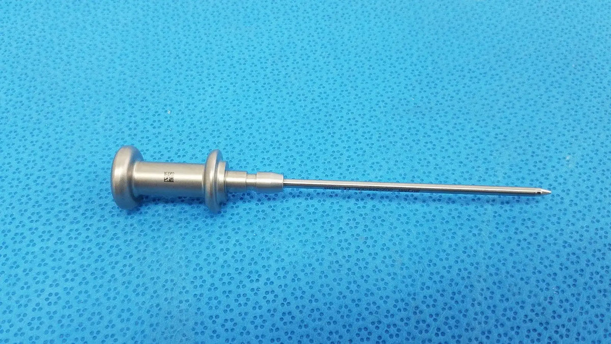 Silver stainless steel trocar surgical orthopedic instrument with slender pointed tip and textured handle for precision use