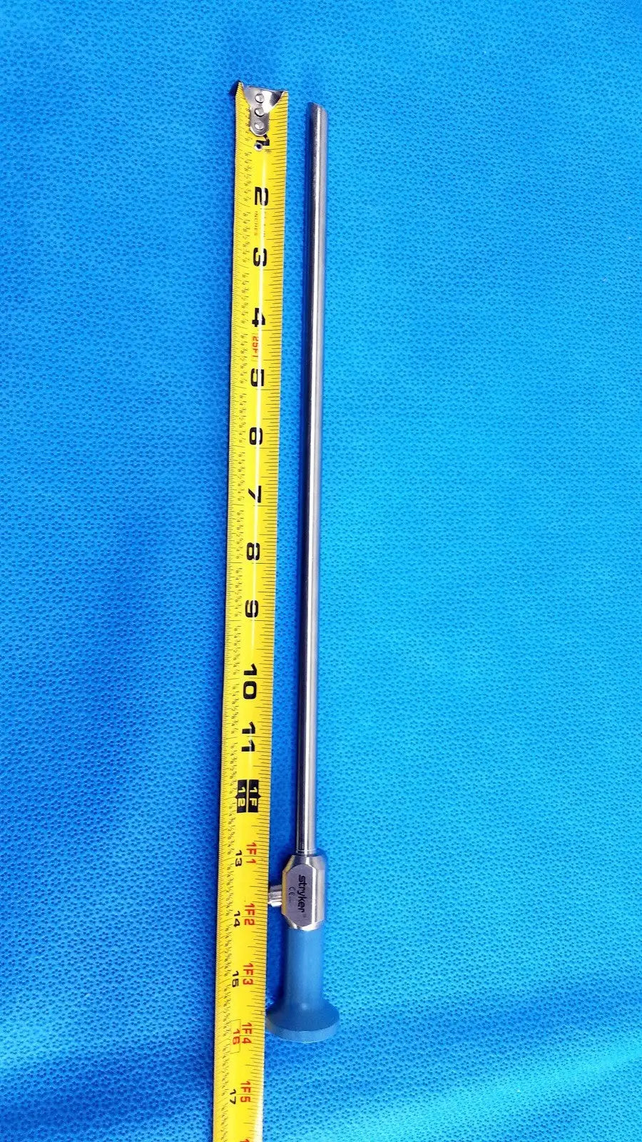 Silver surgical autoclavable endoscope with blue handle featuring a long slender metallic shaft 10mm 30° autoclavable endoscope
