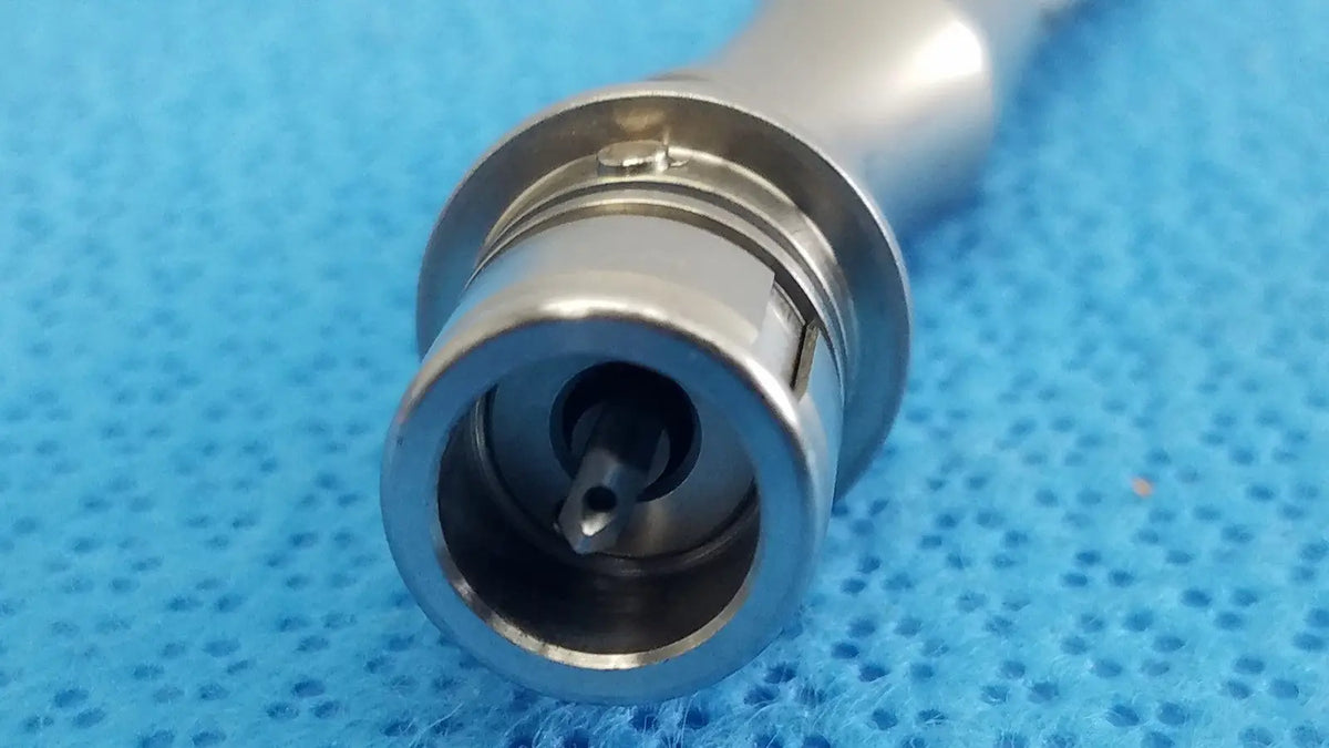 Silver surgical angled saber portmann chuck with polished metallic finish and precise mechanical components from stryker series