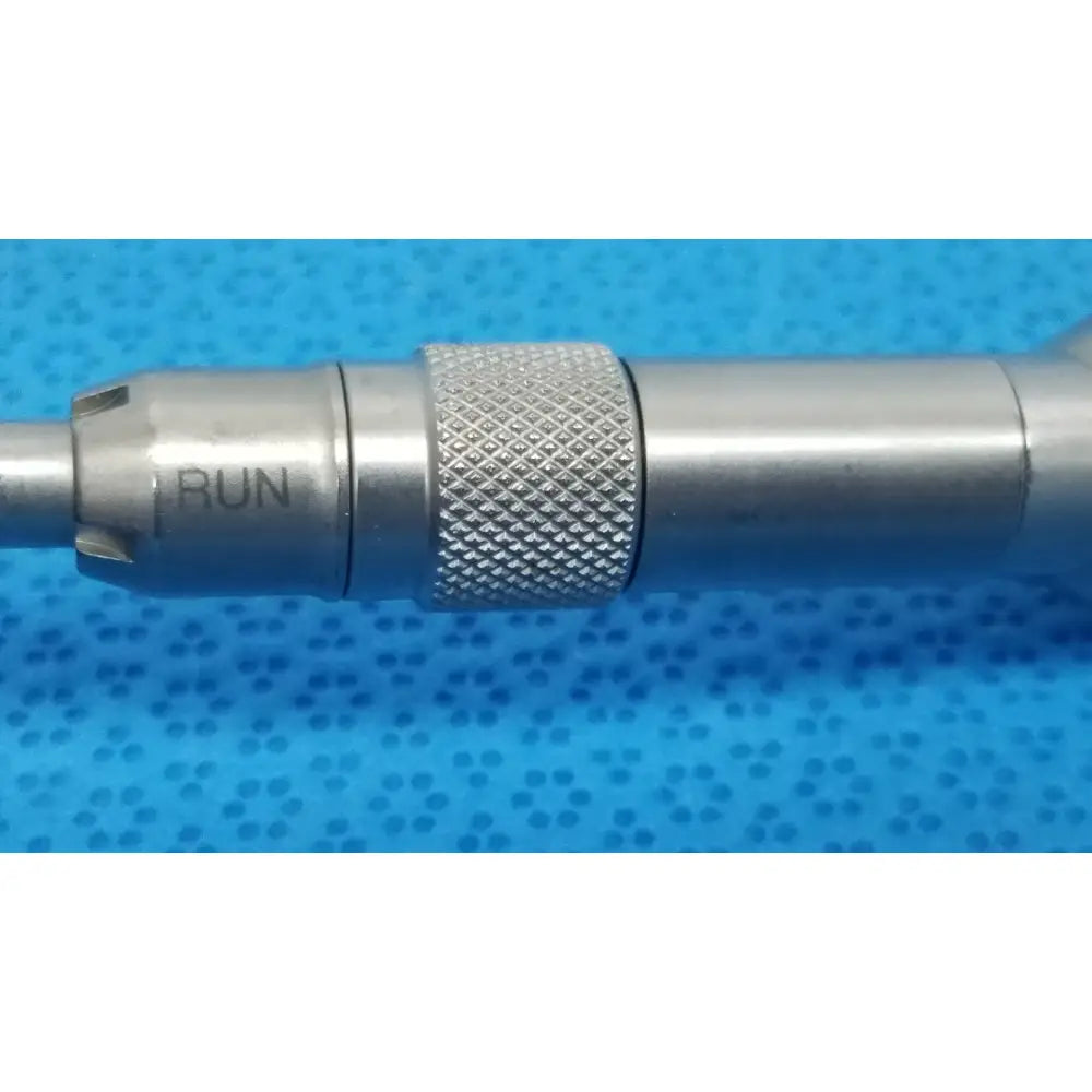 Silver metallic tsp saber drill with textured knurled grip and engraved run marking for reuse medical applications