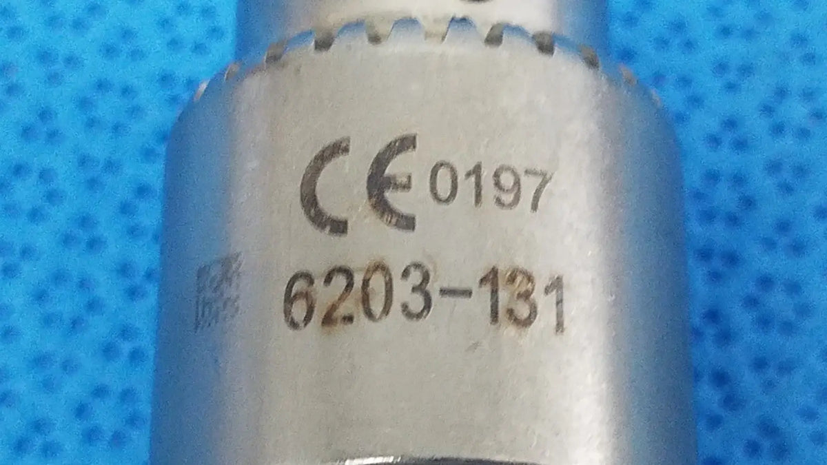 Silver-colored metal socket wrench with keyed chuck and engraved markings 6203-131 for reuse medical applications